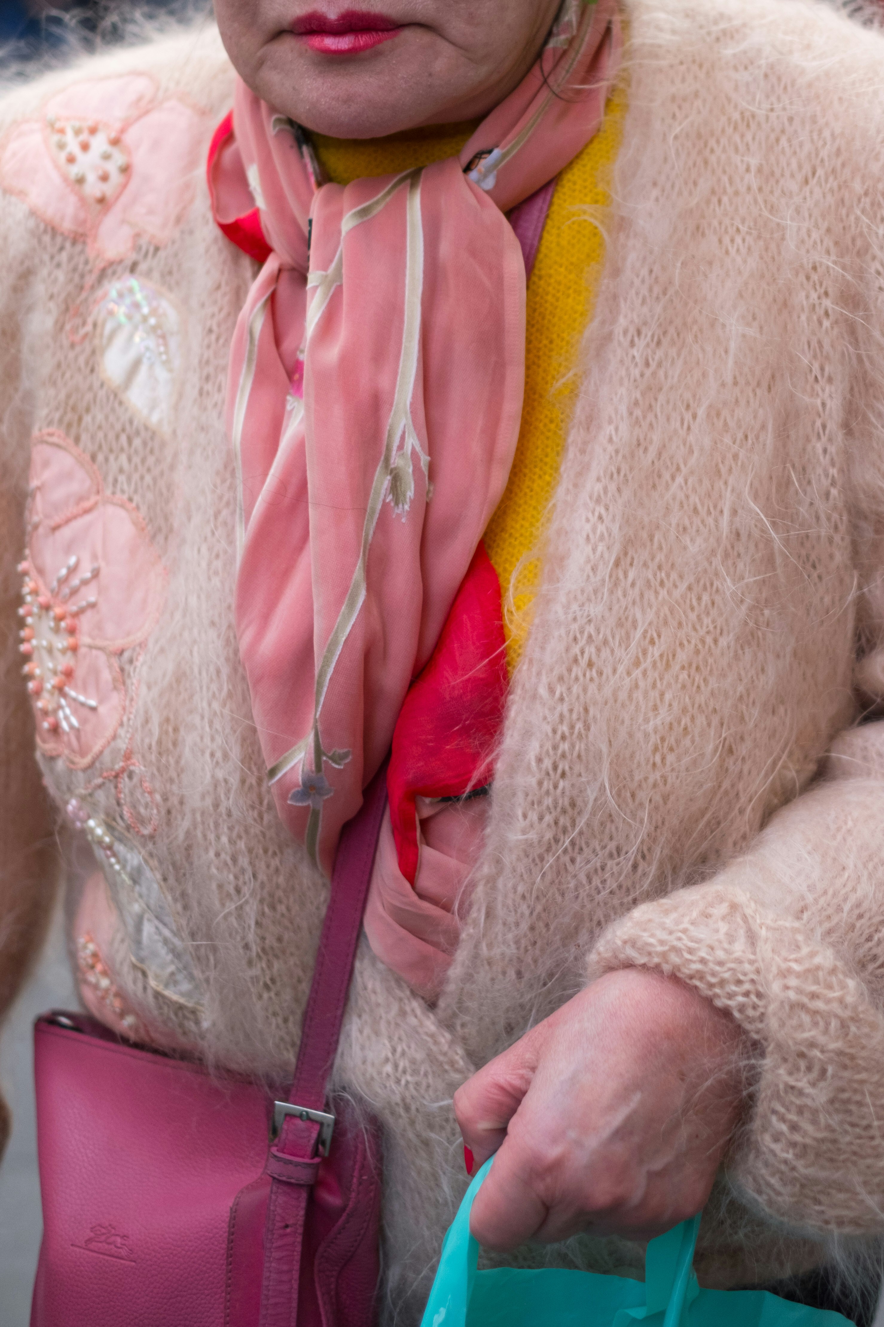 woman wearing sweater and scarf